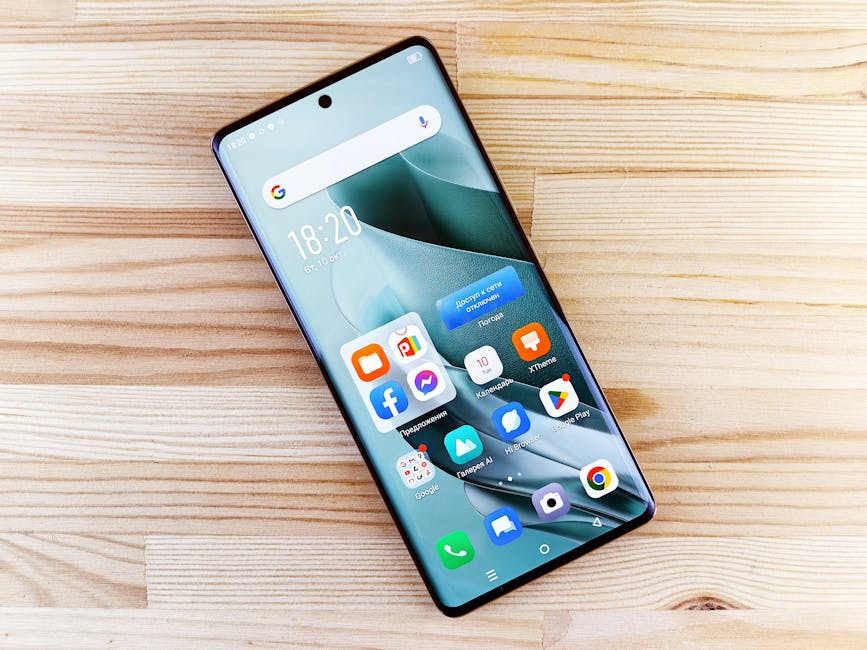 A sleek smartphone showing diverse apps on a bright wooden surface, showcasing technology in a top-view composition.